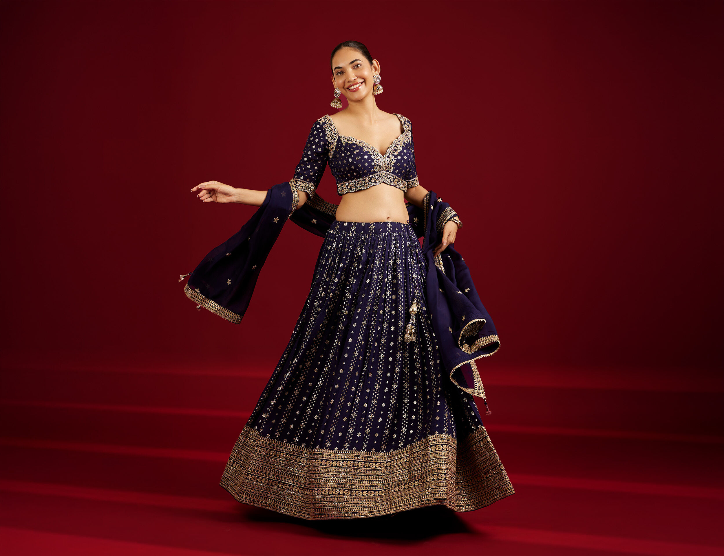 Women wearing beautifull purple mirror work lehenga 